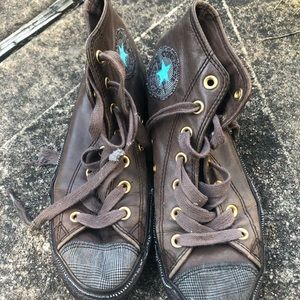 Brown converse high top shoes